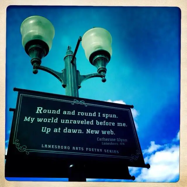 Poem displayed on streetlight background