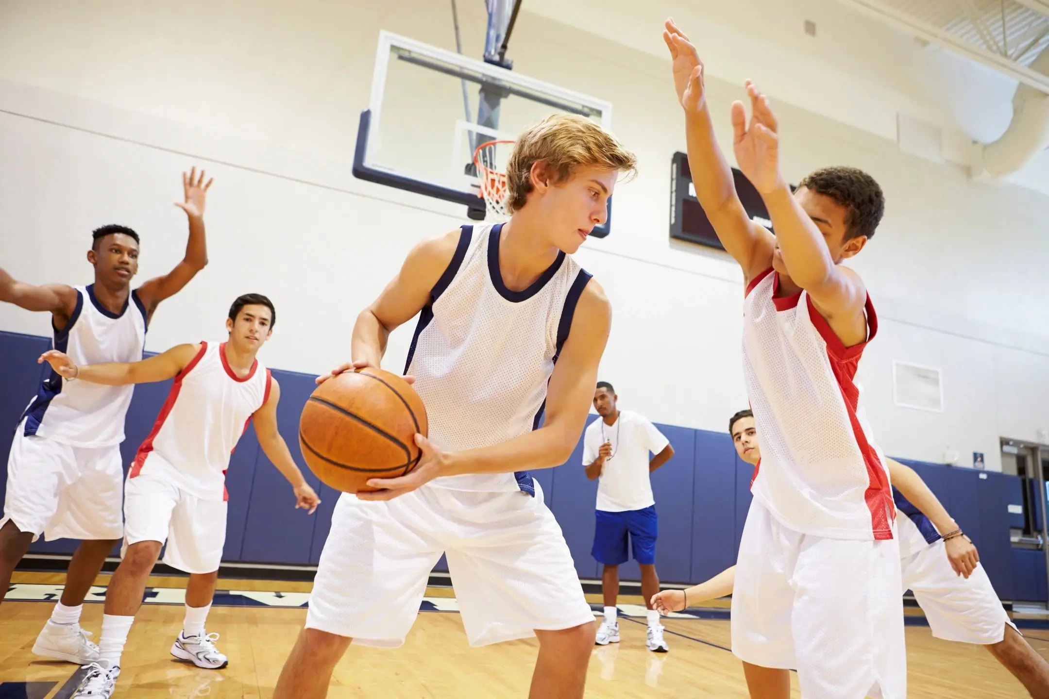 Young athletes playing competitive basketball game