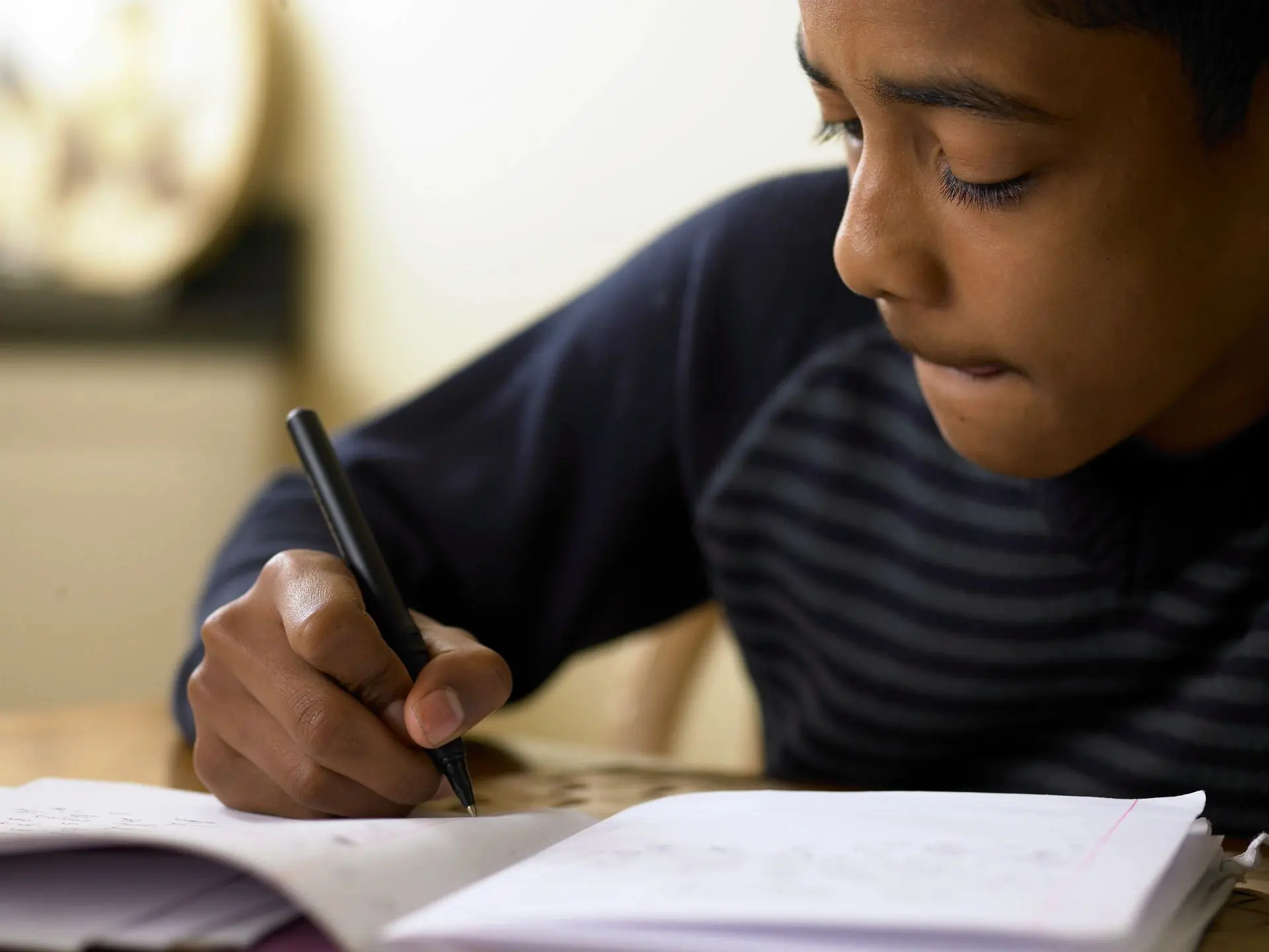 Child concentrating on schoolwork assignment