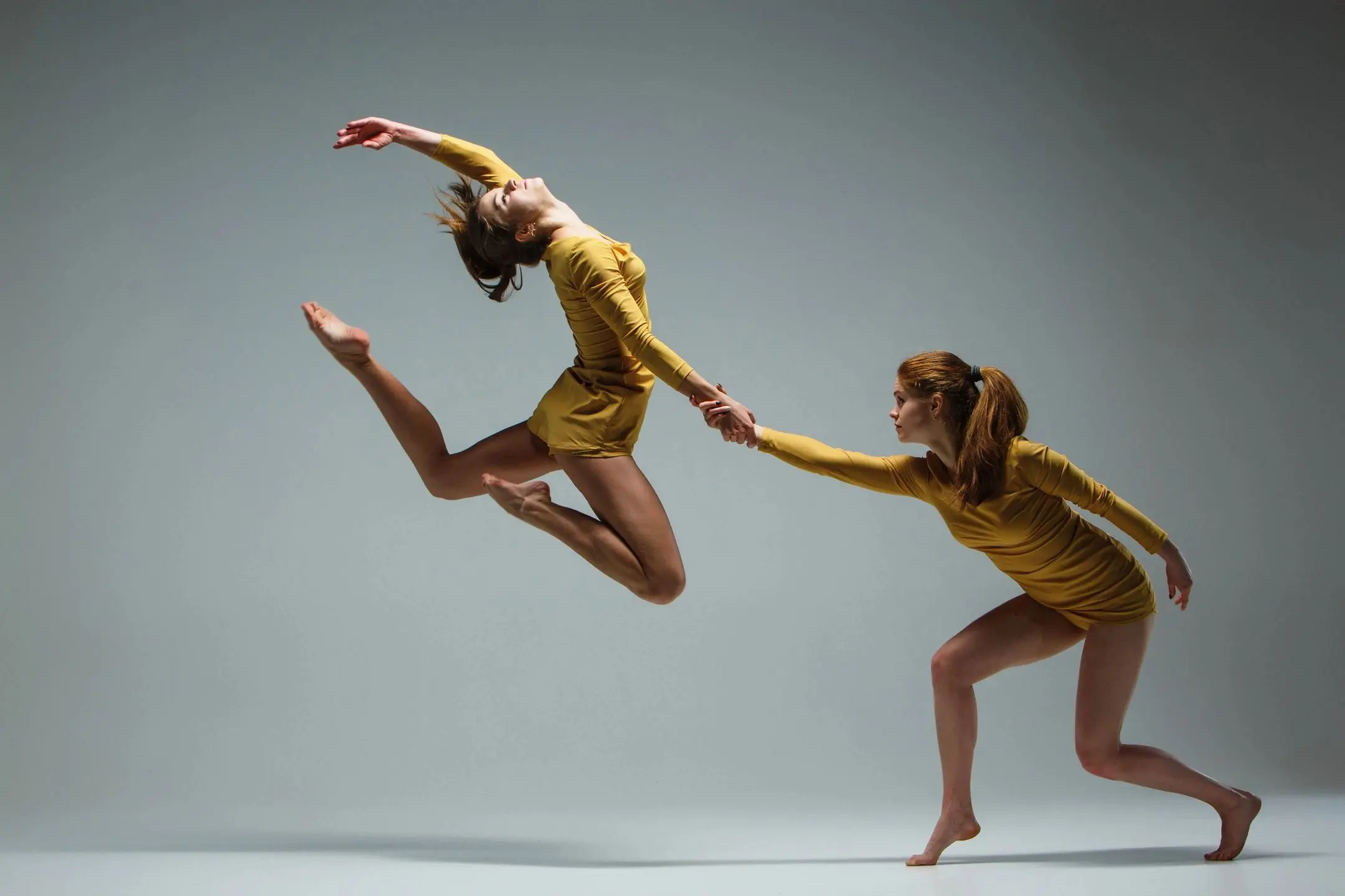 Dancers in motion with dramatic lighting
