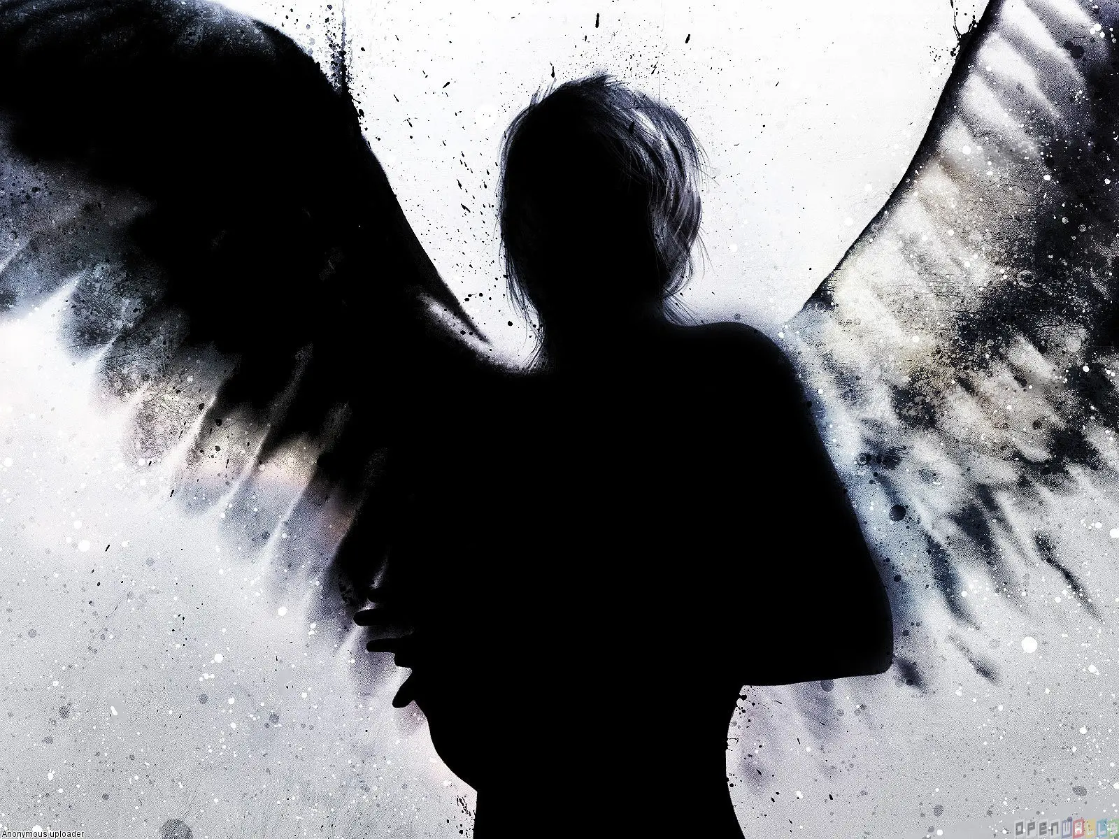 Silhouette of angel with wings spread