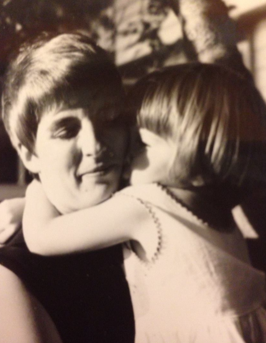 Child hugging adult affectionately