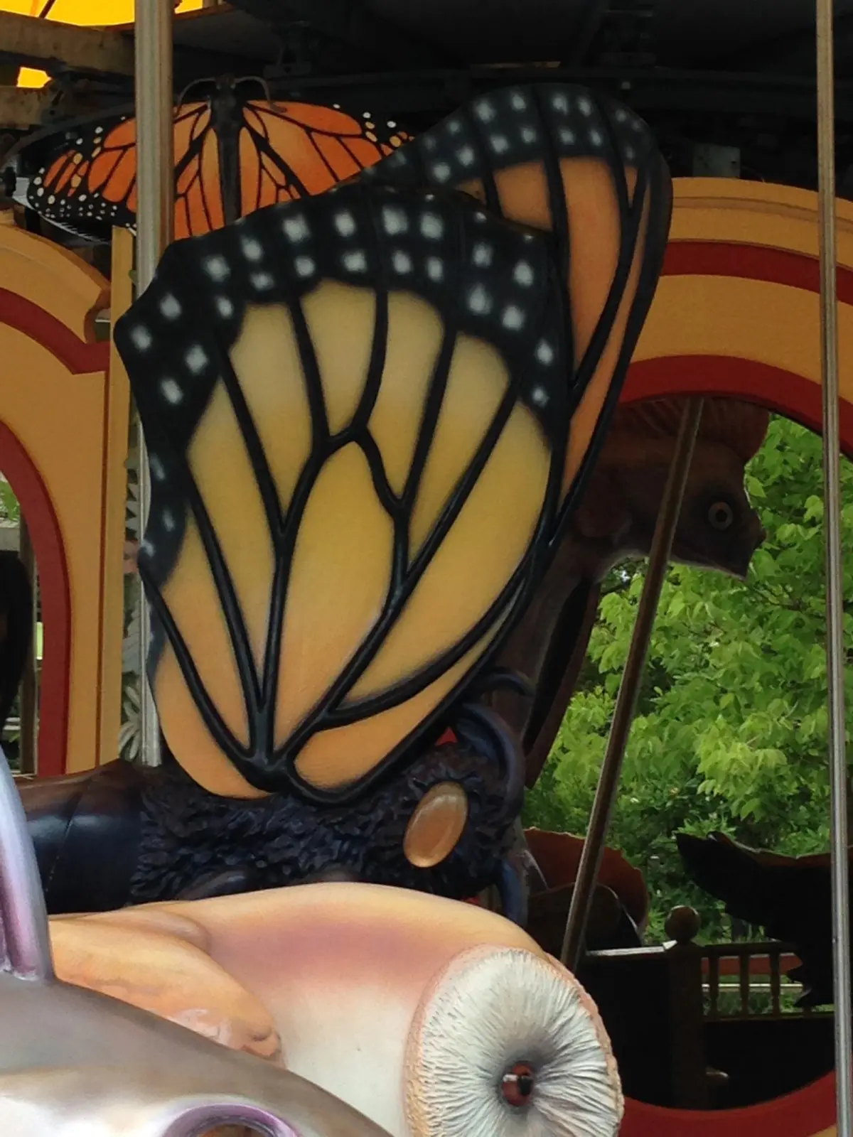 Butterfly-themed carousel ride detail