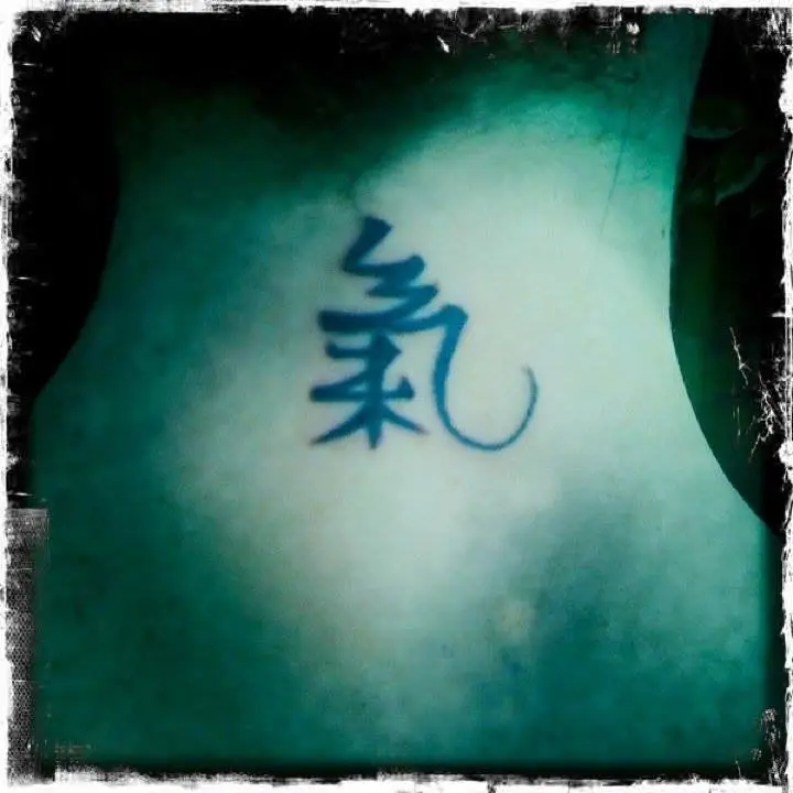Neck tattoo featuring Chinese calligraphy