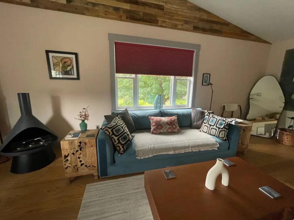 Cozy living room with blue sofa.
