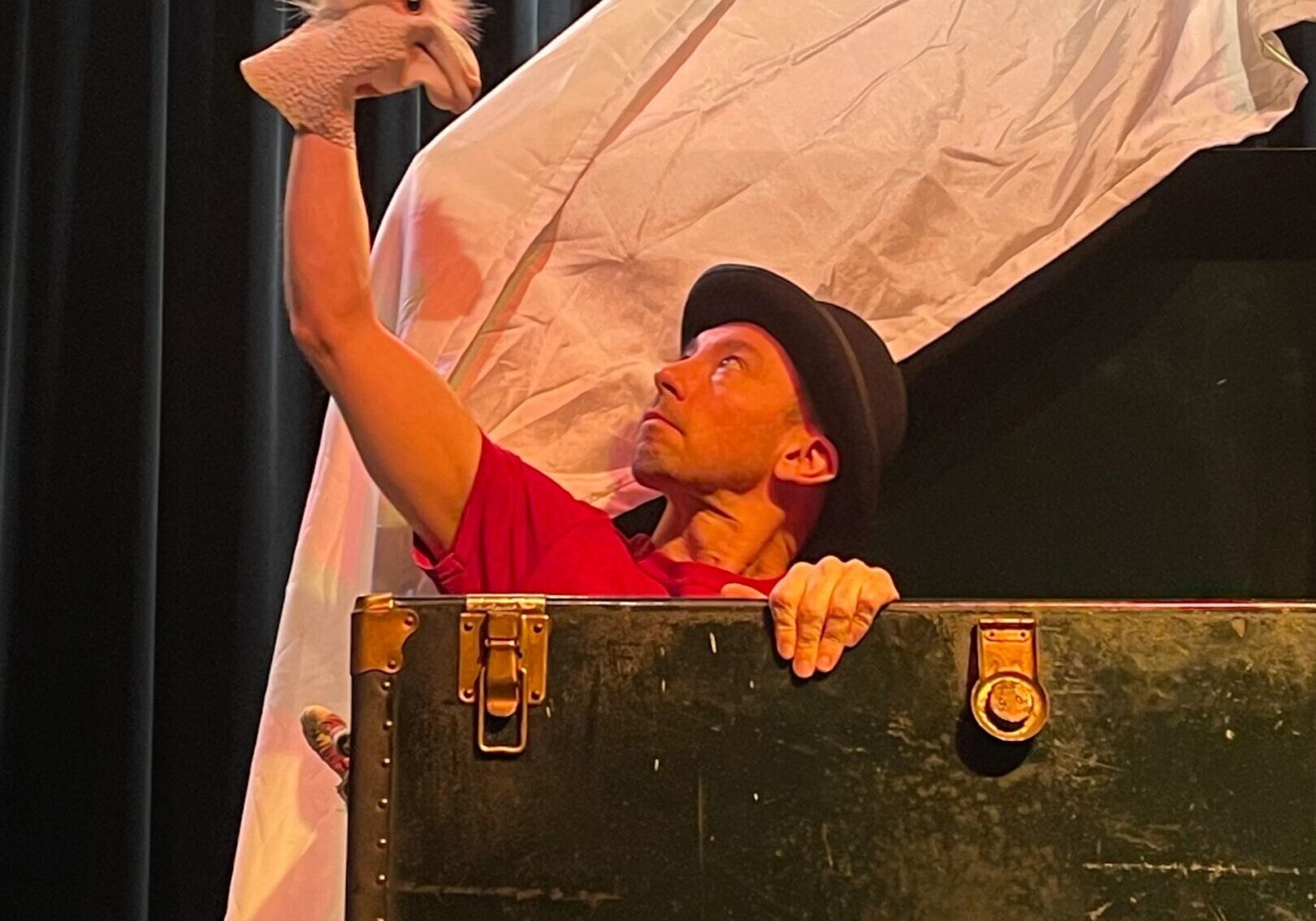 Man in hat with puppet