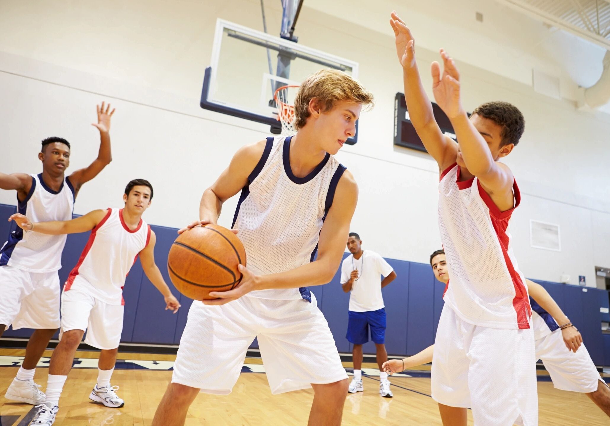Young athletes playing competitive basketball game