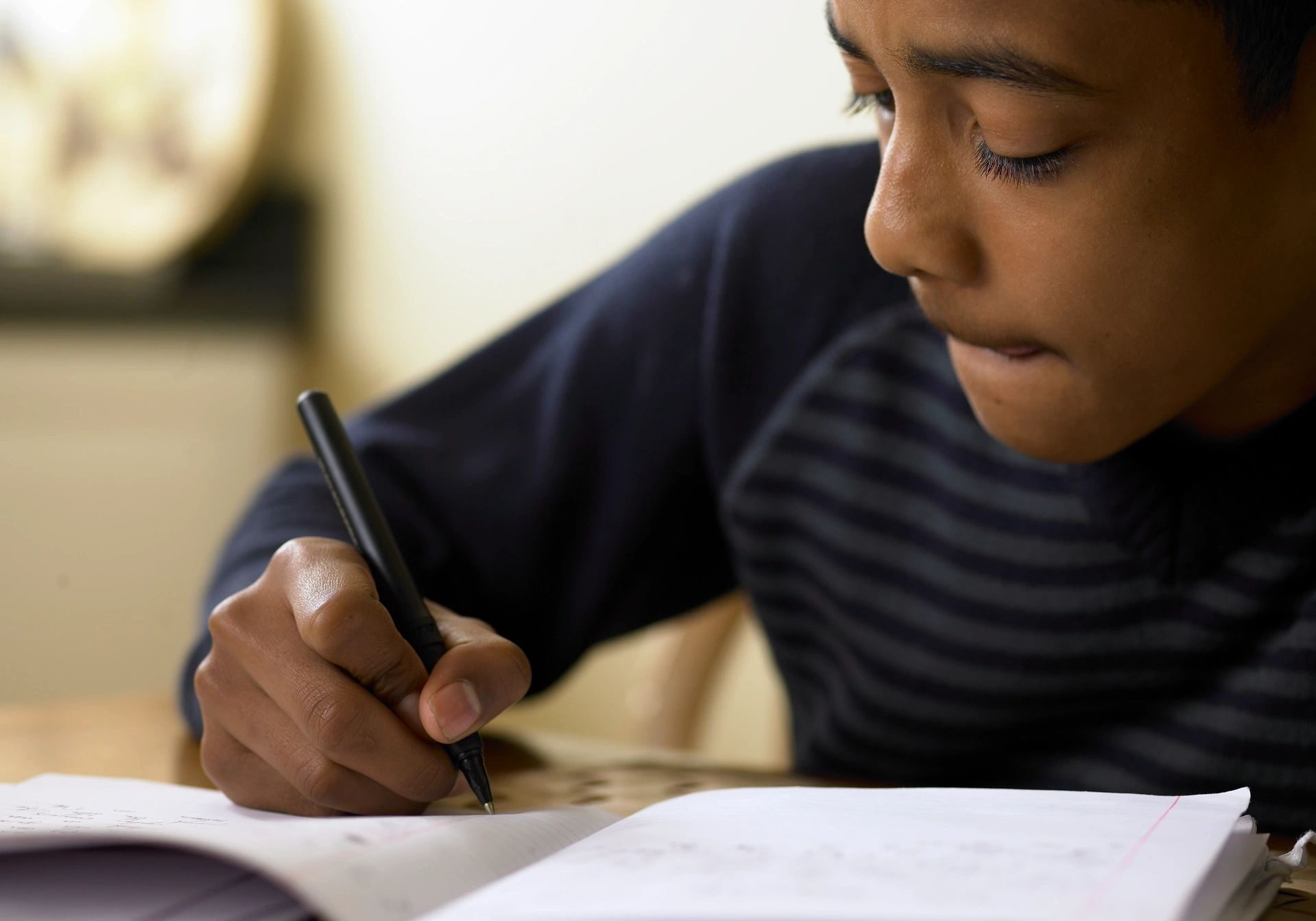 Child concentrating on schoolwork assignment