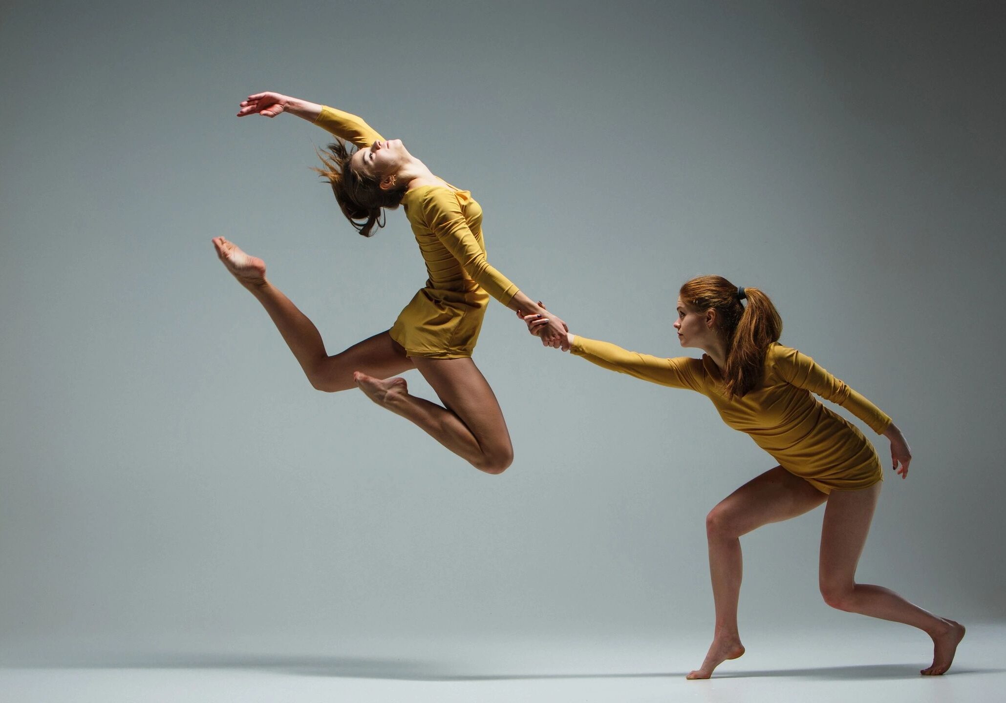 Dancers in motion with dramatic lighting