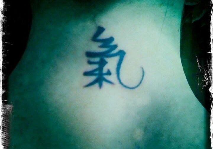 Neck tattoo featuring Chinese calligraphy